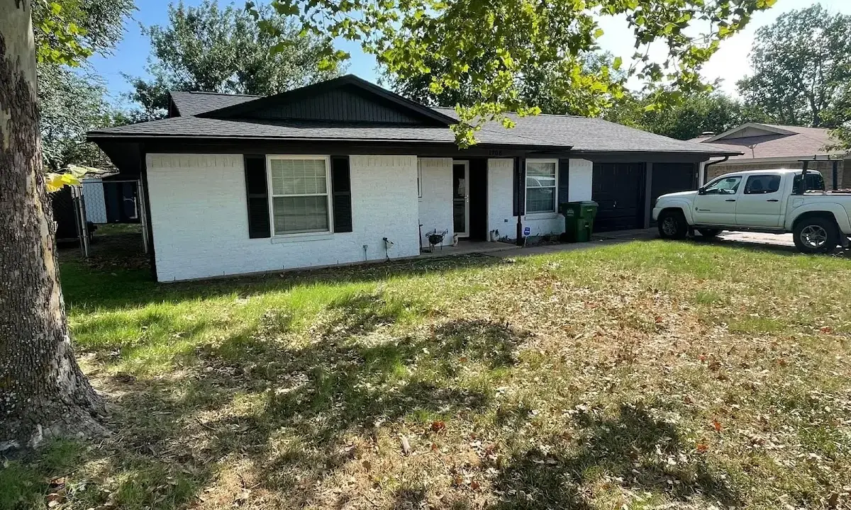 Professional roofing crew working on a residential roof in Long Grove